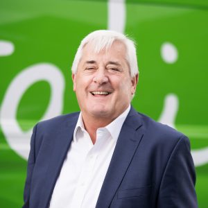 Headshot of Paul Dreschler standing in front of Felix branded van