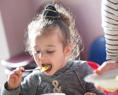 Dow0079980  Fareshare London Telegraph Christmas Charity Pic Shows Children enjoying their meals at Ann Bernadt Nursery in Peckham