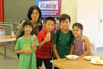 Family Displaying FareShare Food