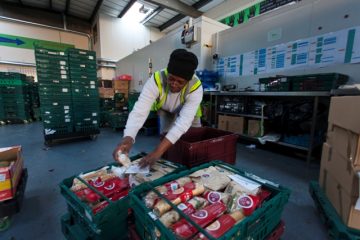 Volunteer Mercia sorting sandwiches