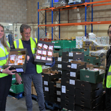 FareShare staff with Gousto donated food in warehouse