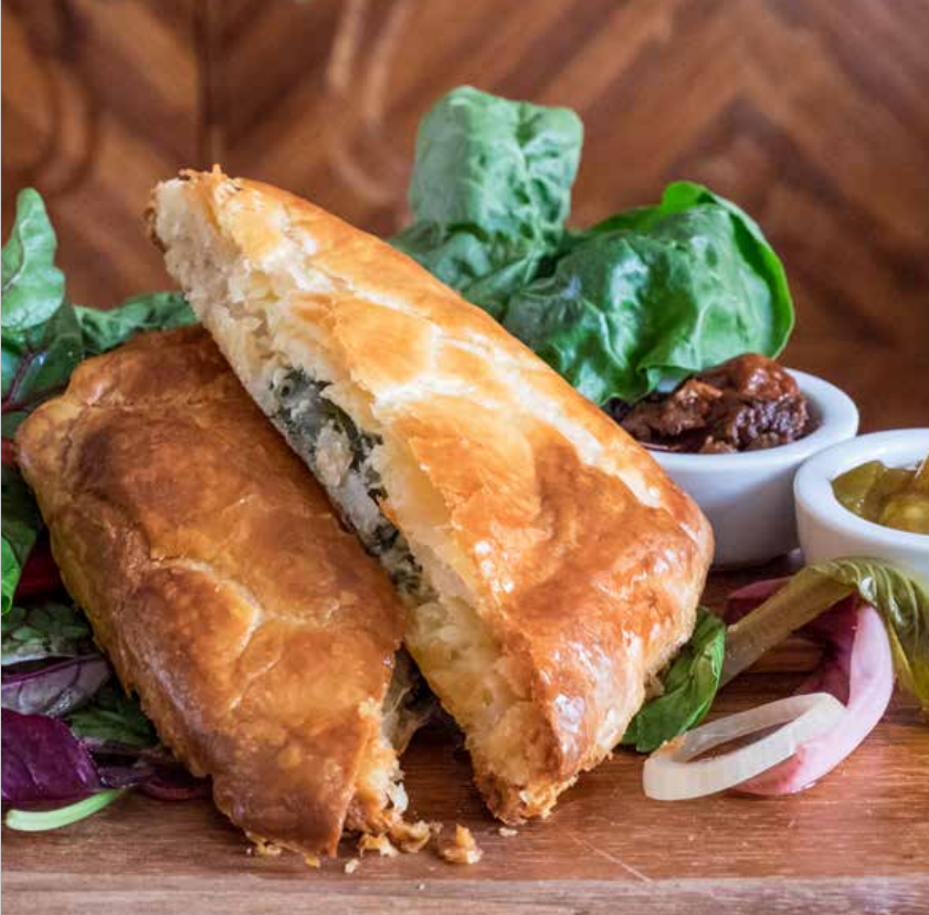 photograph of chard and cheese slide with salad in background